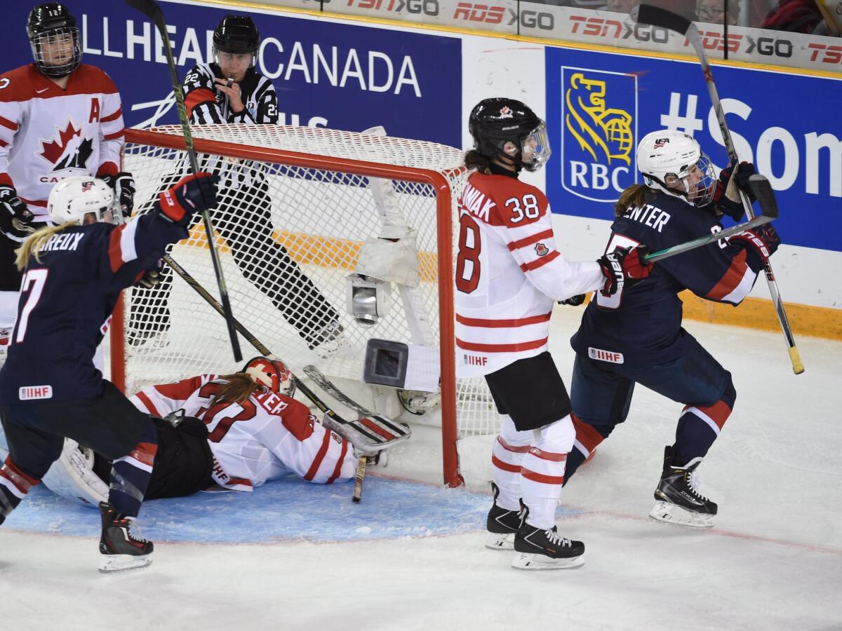 United States center Alex Carpenter celebrates her overtime goal against Canada during the women's world hockey championships.