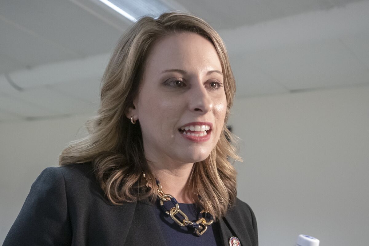 FILE - In this April 3, 2019, file photo, Rep. Katie Hill, D-Calif., talks on Capitol Hill in Washington. The former US House Twitter account of ex-Rep. Hill was hacked Wednesday, Oct. 7, 2020, purportedly by "former staff" who criticized a planned movie about her life and accused Hill of workplace abuse. (AP Photo/J. Scott Applewhite, File)