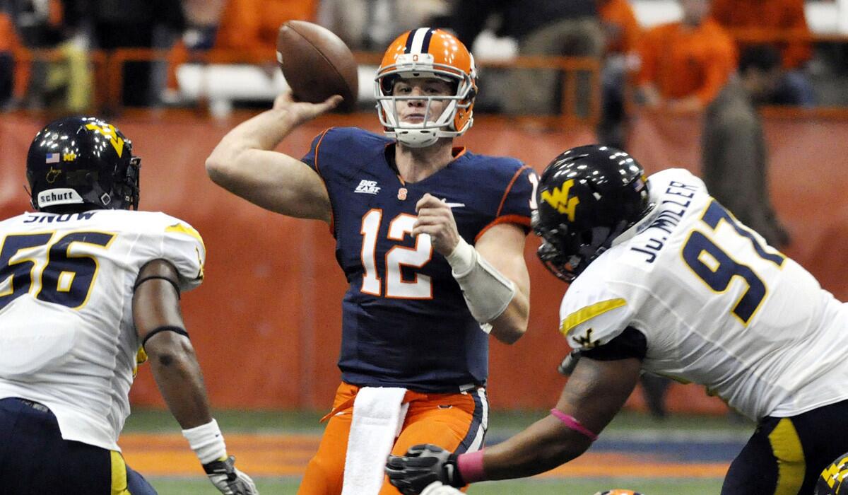 When a quarterback, like Syracuse's Ryan Nassib in this game against West Virginia, is in a throwing motion, his legs will be off-limits for would-be tacklers. It's a new rule for college football.