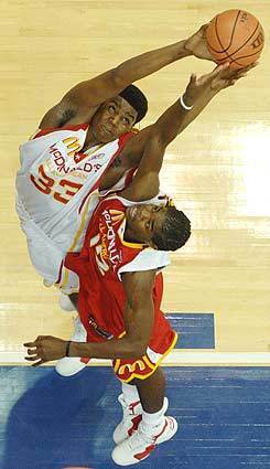 Andrew Bynum, the Lakers top draft choice in 2005, grabs a rebound over Amir Johnson in the McDonalds All-American Game. Johnson, from Westchester High, was selected by Detroit. Bynum attended St. Joseph High in Metuchen, N.J. As a senior, he averaged 22 points, 16 rebounds and five blocked shots a game.