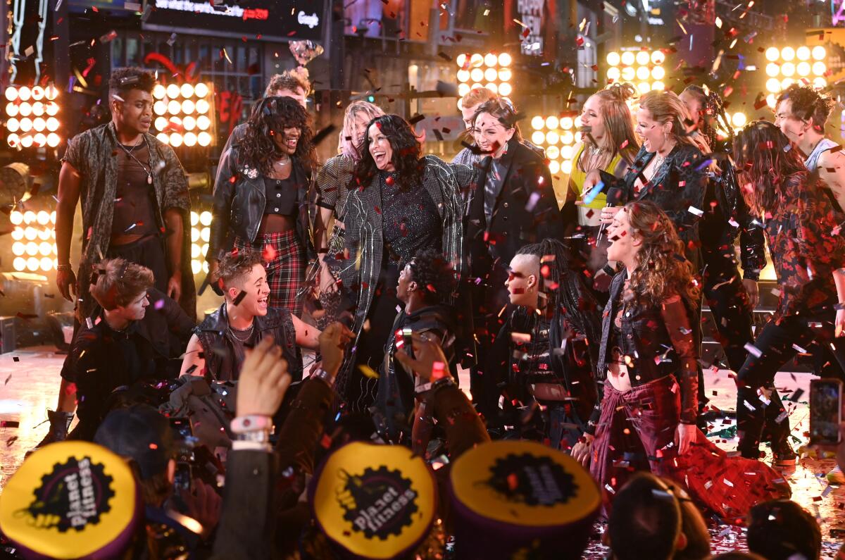 "If there's any validation, comfort, inspiration or soothing that this musical can offer to anyone ... that would be my dream."” said Morissette, pictured performing with the musical's cast in Times Square.