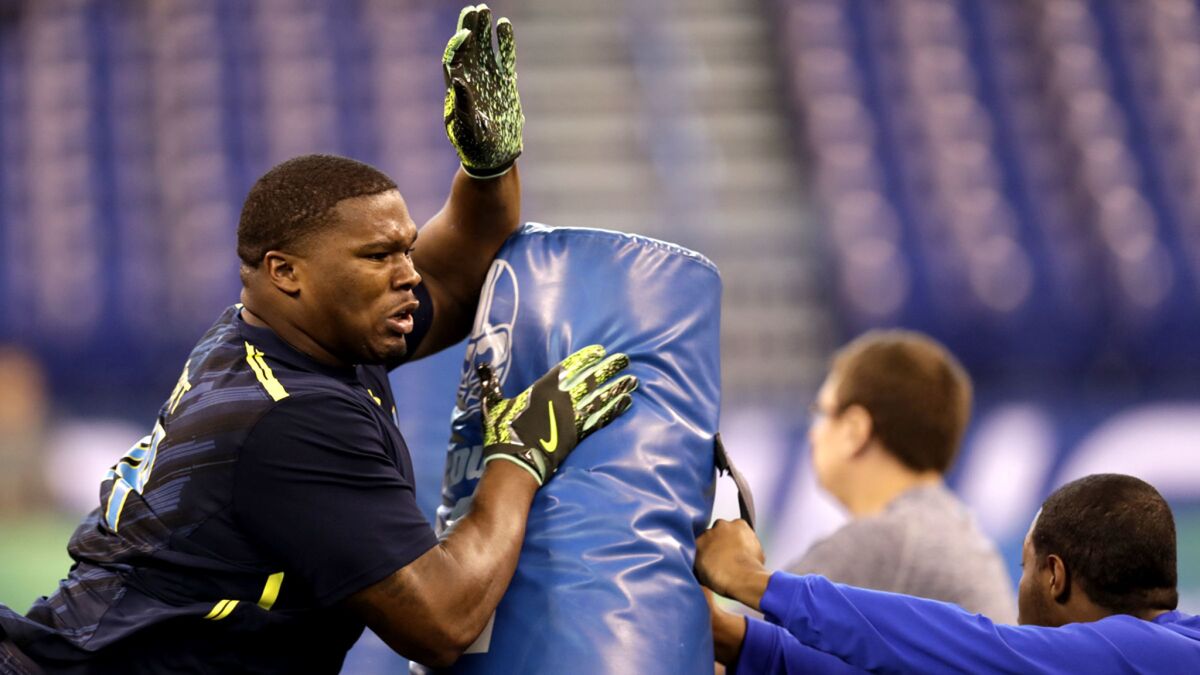 Tulane defensive lineman Tanzel Smart participates in a drill at the NFL combine in March.