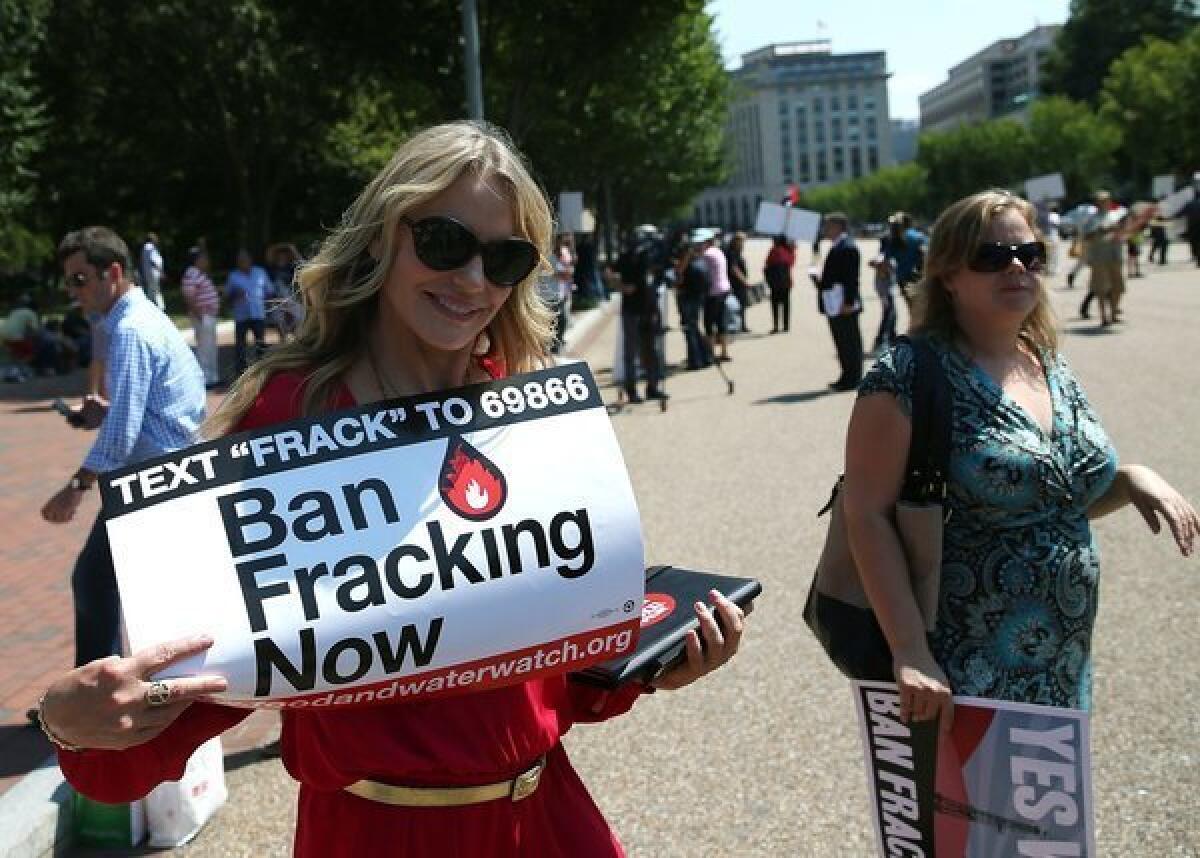 Actress Daryl Hannah, left, participates in a rally against fracking on federal land, in front of the White House. Hannah joined the group Americans Against Fracking to call on President Obama and the Bureau of Land Management to ban fracking on federal land.