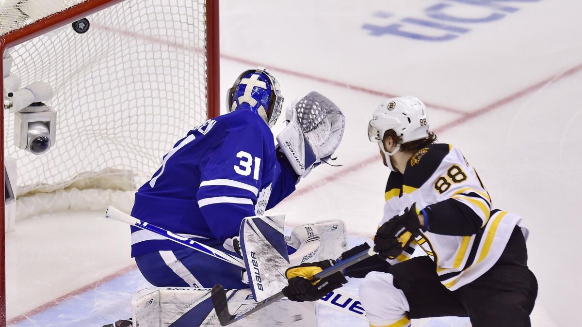 Boston Bruins right wing David Pastrnak (88) scores on Toronto Maple Leafs goaltender Frederik Andersen (31) during the second period.