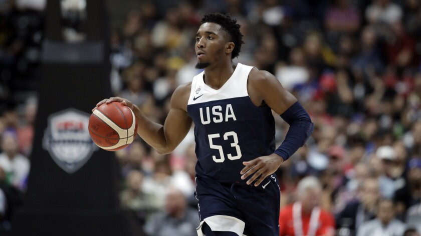 Team USA's Donovan Mitchell brings the ball up the court during an exhibition against Spain in Anaheim.