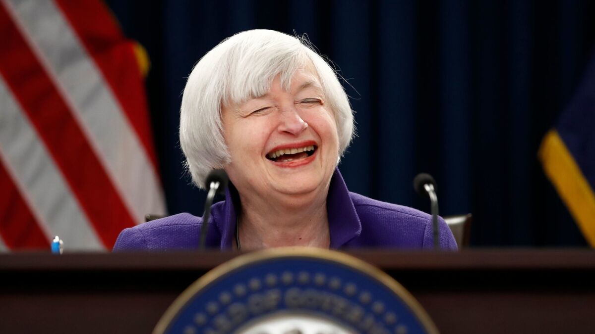 Federal Reserve Chairwoman Janet L Yellen laughs during her final news conference on Dec. 13,