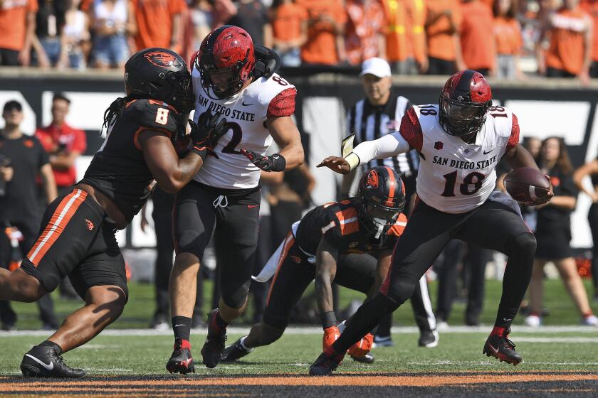 San Diego State quarterback Jalen Mayden (18) runs away from the Oregon State defensive pressure during the second half of an NCAA college football game Saturday, Sept. 16, 2023, in Corvallis, Ore. (AP Photo/Mark Ylen)