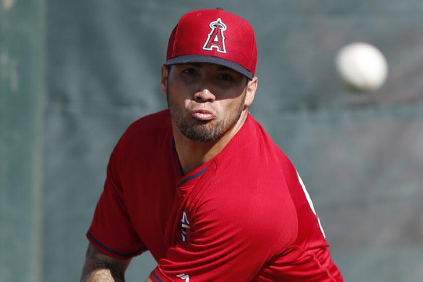 Angels starter Hector Santiago throws a pitch during a spring-training practice session in Tempe, Ariz., on Feb. 18.