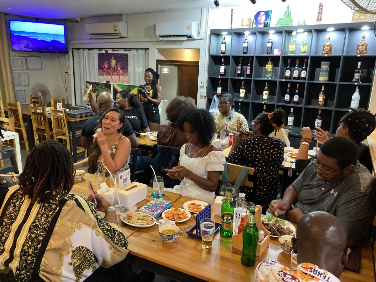 About 20 people of African descent living abroad gather for dinner at a Jamaican restaurant in Bangkok, Thailand to celebrate America’s newest federal holiday, Juneteenth on Saturday, June 18, 2022, in Bangkok, Thailand. As the United States marks only the second federally recognized Juneteenth, Black Americans living overseas have embraced the holiday as a day of reflection and an opportunity to educate people in their host countries on Black history. (AP Photo/Annika Wolters)