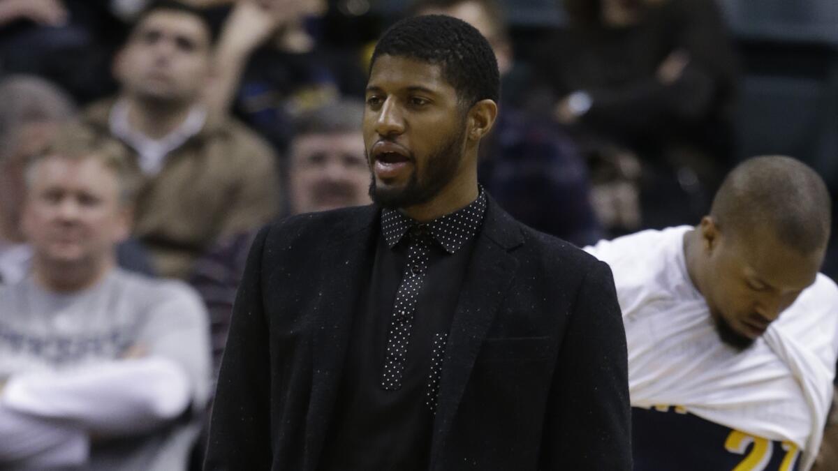 Indiana Pacers forward Paul George watches from the sideline during a game against the Detroit Pistons on Wednesday.