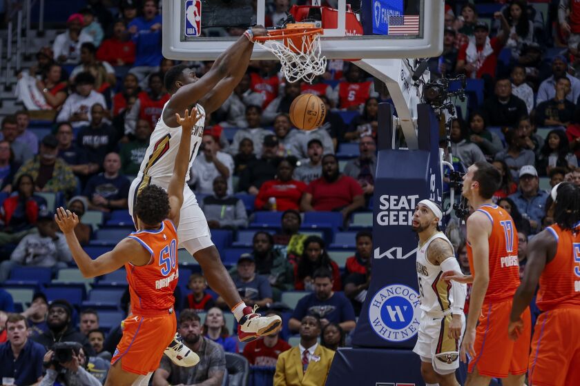 New Orleans Pelicans forward Zion Williamson (1) dunks over Oklahoma City Thunder forward Jeremiah Robinson-Earl in the first quarter of an NBA basketball game in New Orleans, Monday, Nov. 28, 2022. (AP Photo/Derick Hingle)