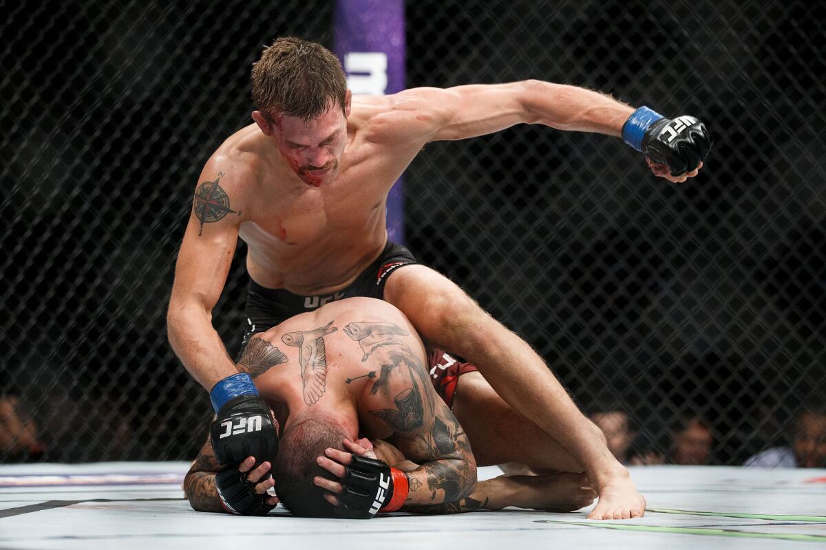 Rick Glenn has top position as he tries to pummel Gavin Tucker during their fight at UFC 215.