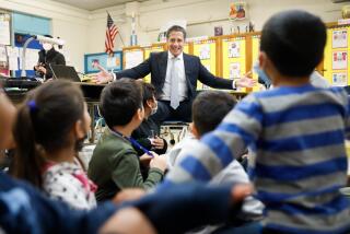 LOS ANGELES-CA - DECEMBER 19, 2022: LAUSD Superintendent Alberto Carvalho, center, visits a first-grade class at 75th Street Elementary School in Los Angeles for the launch of "acceleration days," two days of optional learning that were moved from the middle of the school calendar to the first two weekdays of winter break, on Monday, December 19, 2022. (Christina House / Los Angeles Times)