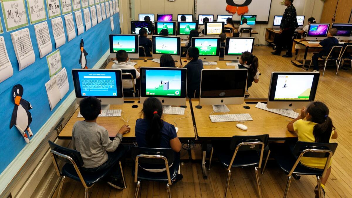 LAUSD students at Ritter Elementary School use computers to practice their math skills.