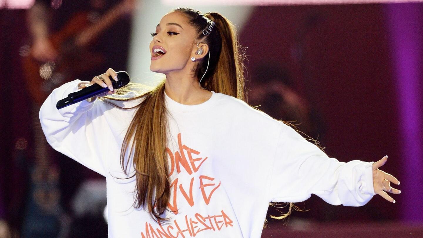 In this Sunday, June 4, 2017, handout photo provided by Dave Hogan for One Love Manchester, singer Ariana Grande performs at the One Love Manchester tribute concert in Manchester, north western England, Sunday, June 4, 2017. One Love Manchester is raising money for those affected by the bombing at the end of Ariana Grande's concert in Manchester on May 22, 2017.