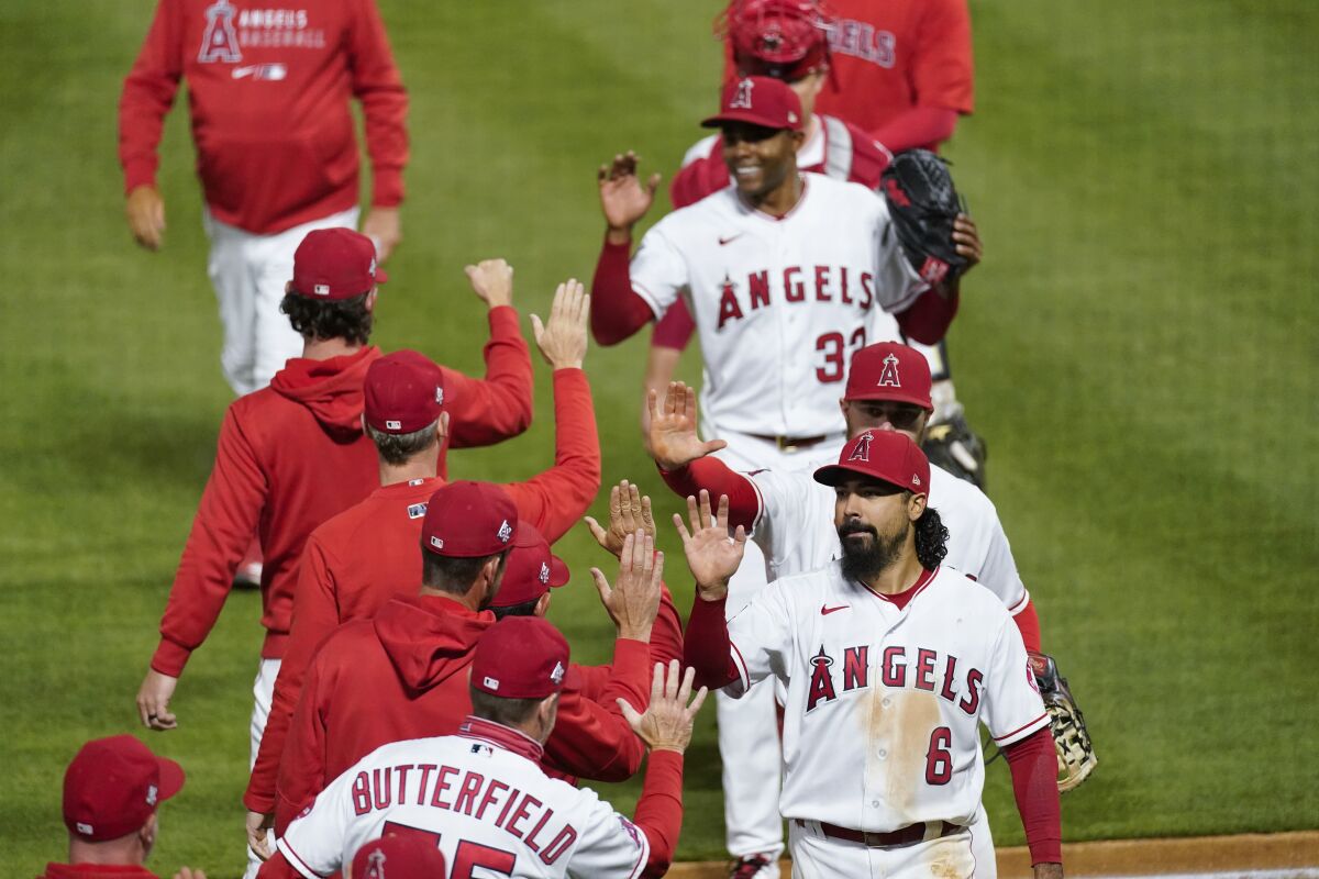 Angels celebrate their 6-1 win over the Kansas City Royals on Wednesday.