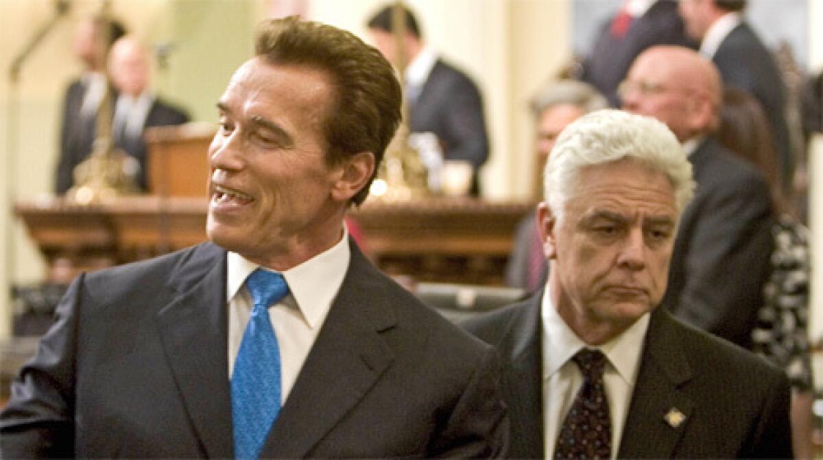 "The economics of this makes sense," Gov. Schwarzenegger said, left, asserting that the new costs would be $10 a year for the average California homeowner. "Consumers and the state will end up saving money."