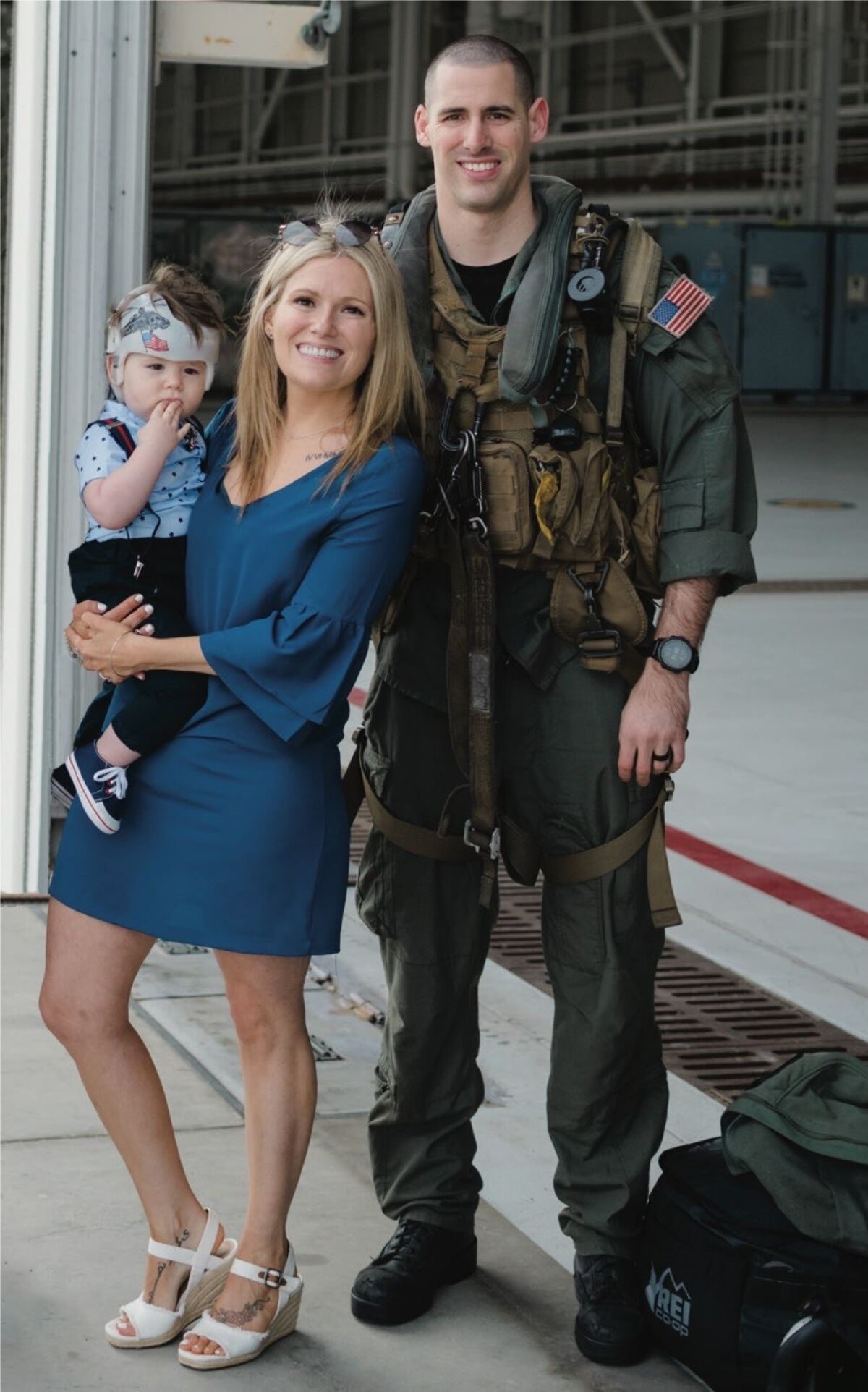 Naval Air Crewman 2nd Class James P. Buriak, wife Megan, and son Caulder