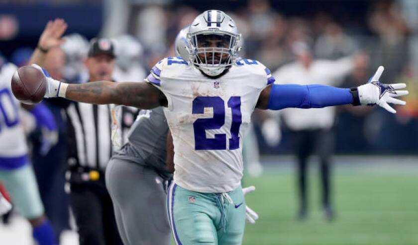 Dallas Cowboys running back Ezekiel Elliott reacts during a game against the Detroit Lions.