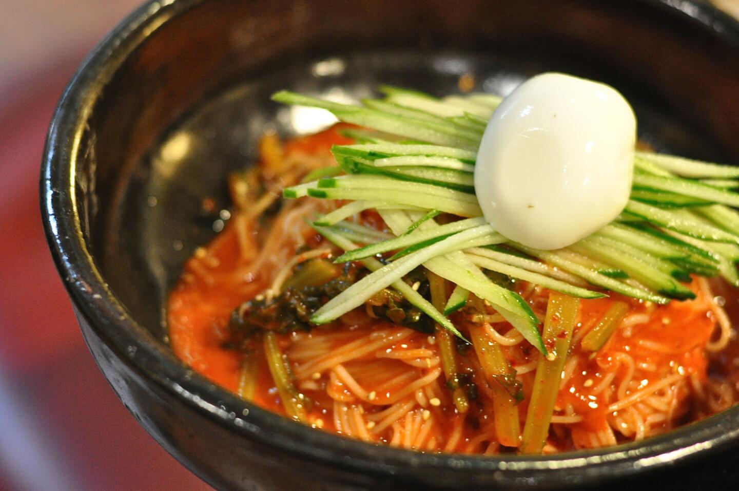 The yulmu bibim guk su, another cold noodle dish with cucumbers and an egg, at Hangari.