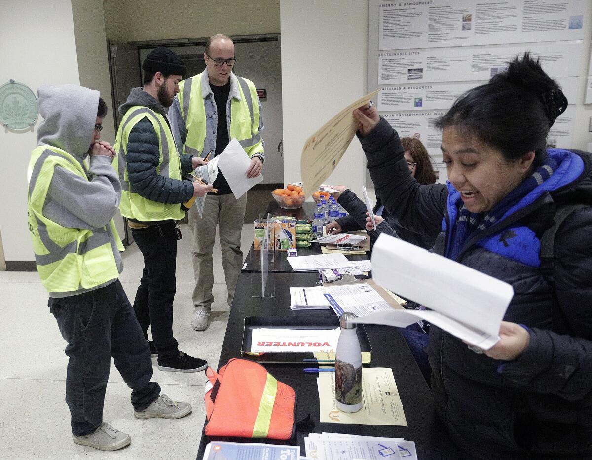 A group of volunteers in Burbank return to the city's community services building after a night of counting the city's homeless population as part of the annual Greater Los Angeles Homeless Count on Tuesday, Jan. 21. 