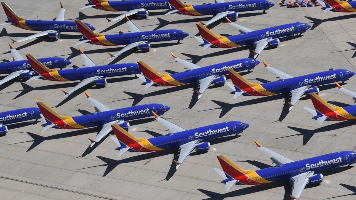 Southwest Airlines Boeing 737 Max aircraft are parked on the tarmac at the Southern California Logistics Airport in Victorville after being grounded.