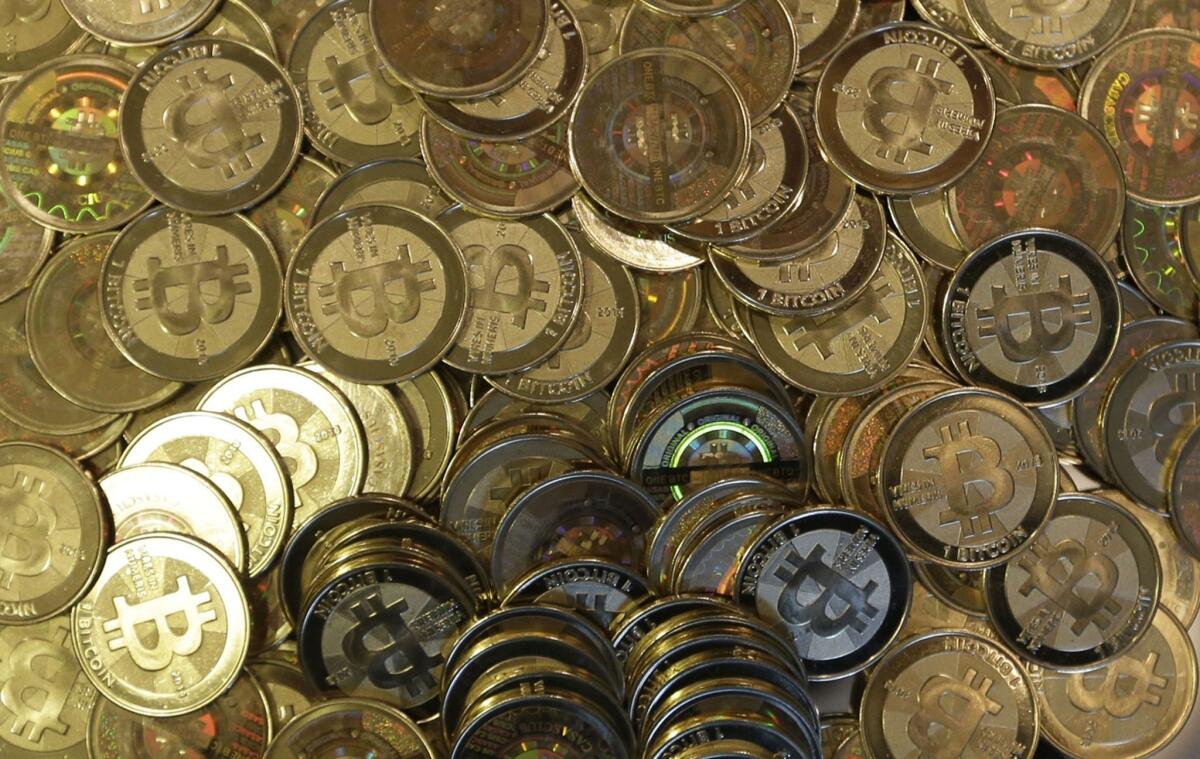 A file photo shows bitcoin tokens in Utah.