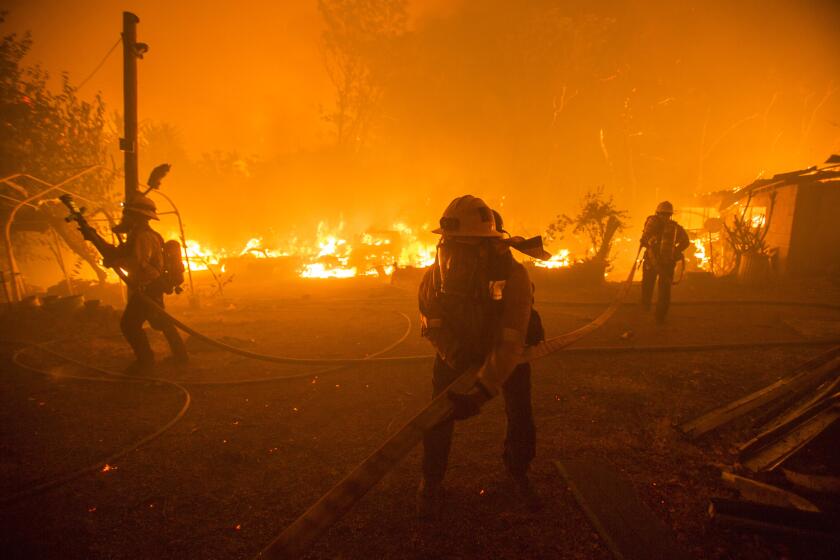 Firefighters battle the Lake Hughes fire in Angeles National Forest.