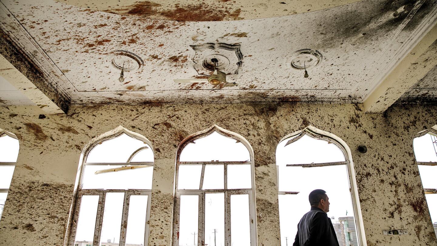 Blood covers the walls and charred ceiling of the Imam Zaman mosque in Kabul after a suicide bomber threw a grenade into the women's section of the mosque and then blew himself up. Dozens of worshipers were killed in the attack.