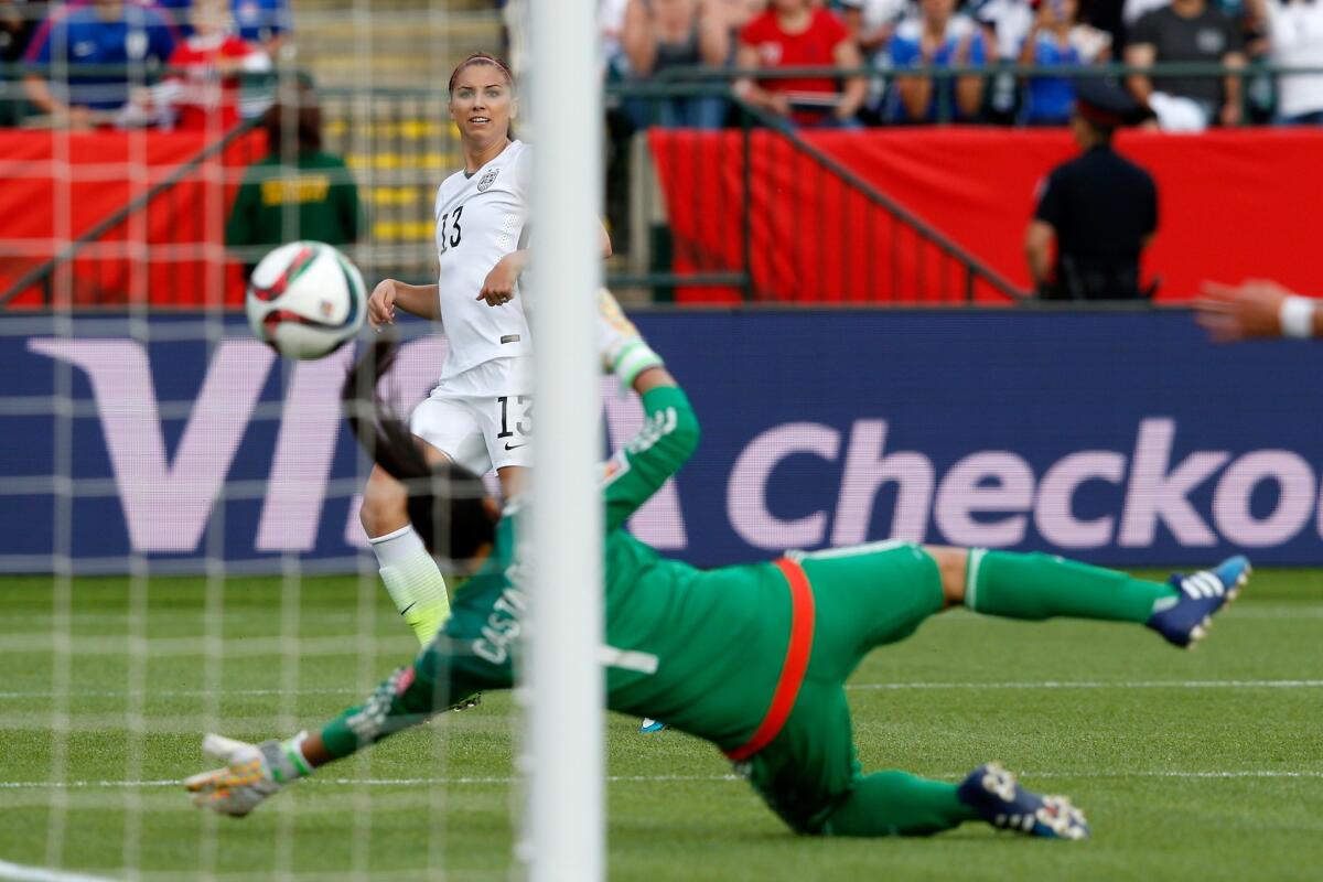 EDMONTON, AB - JUNE 22: Alex Morgan #13 of the United States scores her first goal against goalkeeper Stefany Castano #1 of Colombia in the second half in the FIFA Women's World Cup 2015 Round of 16 match at Commonwealth Stadium on June 22, 2015 in Edmonton, Canada. (Photo by Todd Korol/Getty Images) ** OUTS - ELSENT, FPG - OUTS * NM, PH, VA if sourced by CT, LA or MoD **