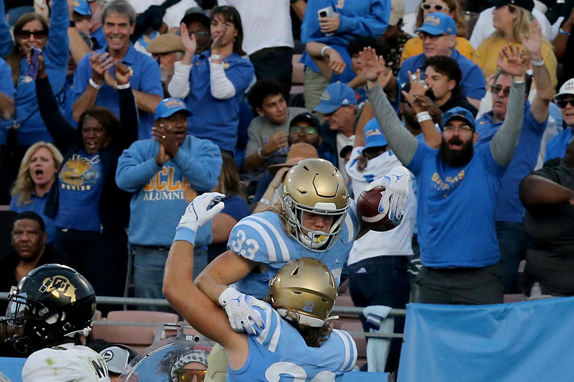 UCLA running back Carson Steele celebrates with teammate Carsen Ryan after scoring a touchdown against Colorado.