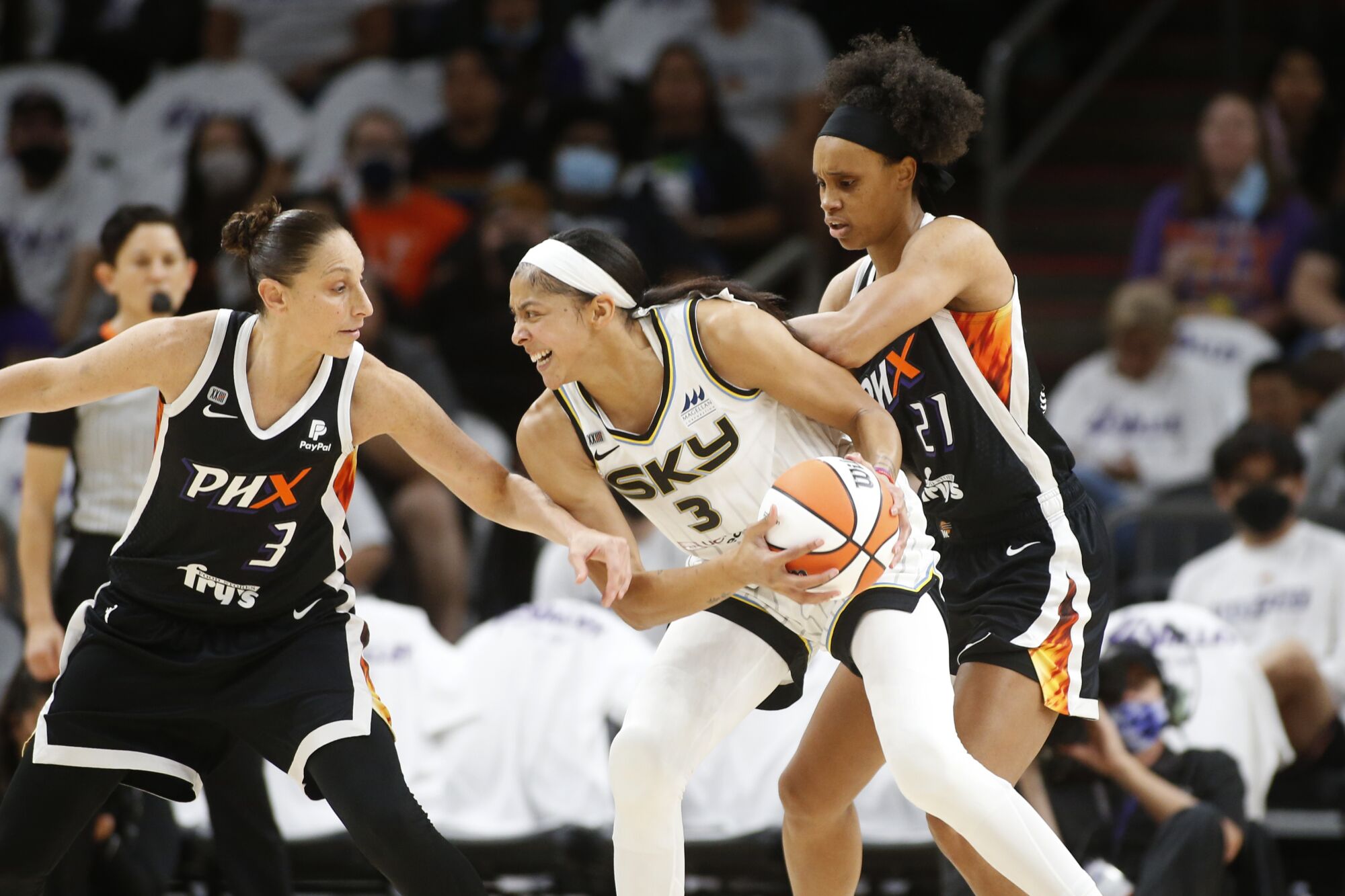 Sky forward Candace Parker is pressured by Mercury guard Diana Taurasi during Game 1 of the WNBA Finals