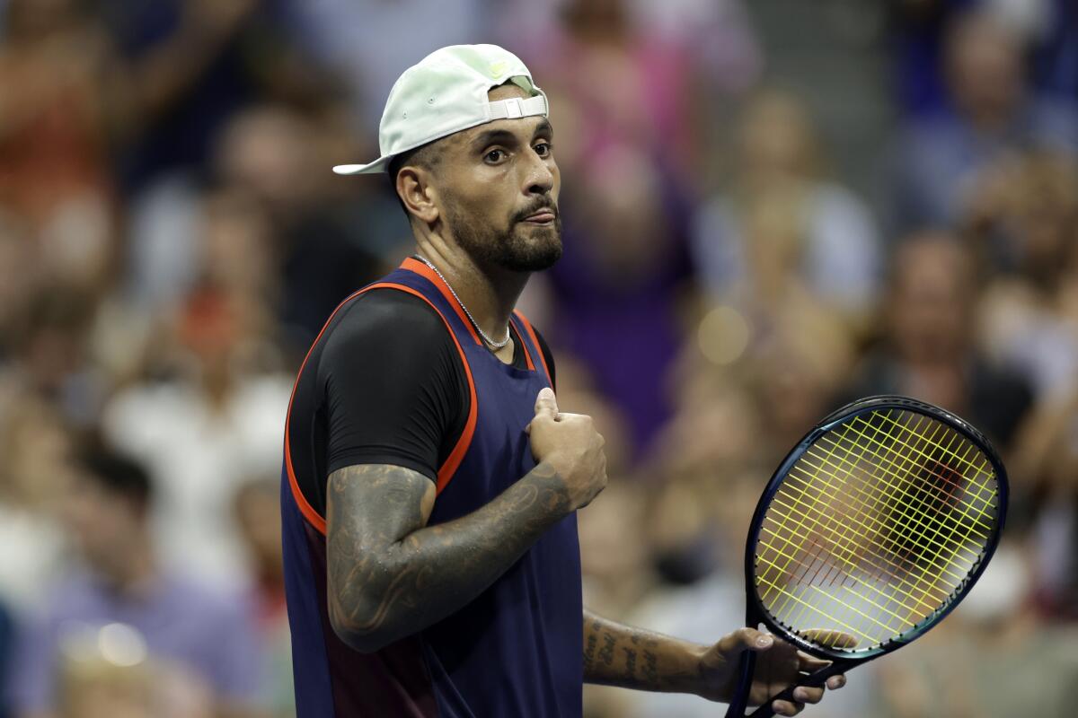 Nick Kyrgios, of Australia, walks across the court after winning his match against Daniil Medvedev, of Russia, during the fourth round of the U.S. Open tennis championships, Sunday, Sept. 4, 2022, in New York. (AP Photo/Adam Hunger)