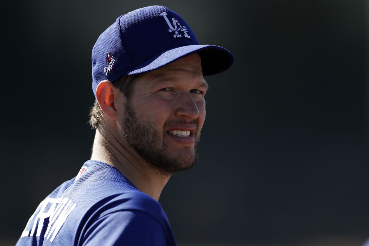 Los Angeles Dodgers pitcher Clayton Kershaw looks on during spring training baseball.