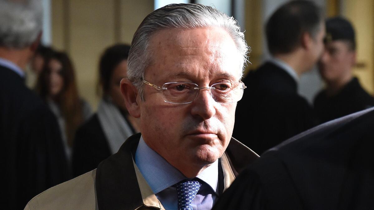 French art dealer Guy Wildenstein leaves a Paris courthouse in January.