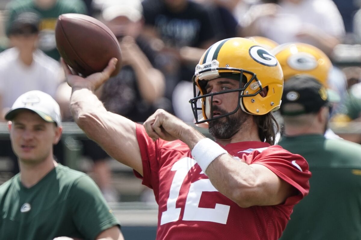 Green Bay Packers' Aaron Rodgers runs a drill at the NFL football team's practice field Tuesday, June 7, 2022, in Green Bay, Wis. (AP Photo/Morry Gash)