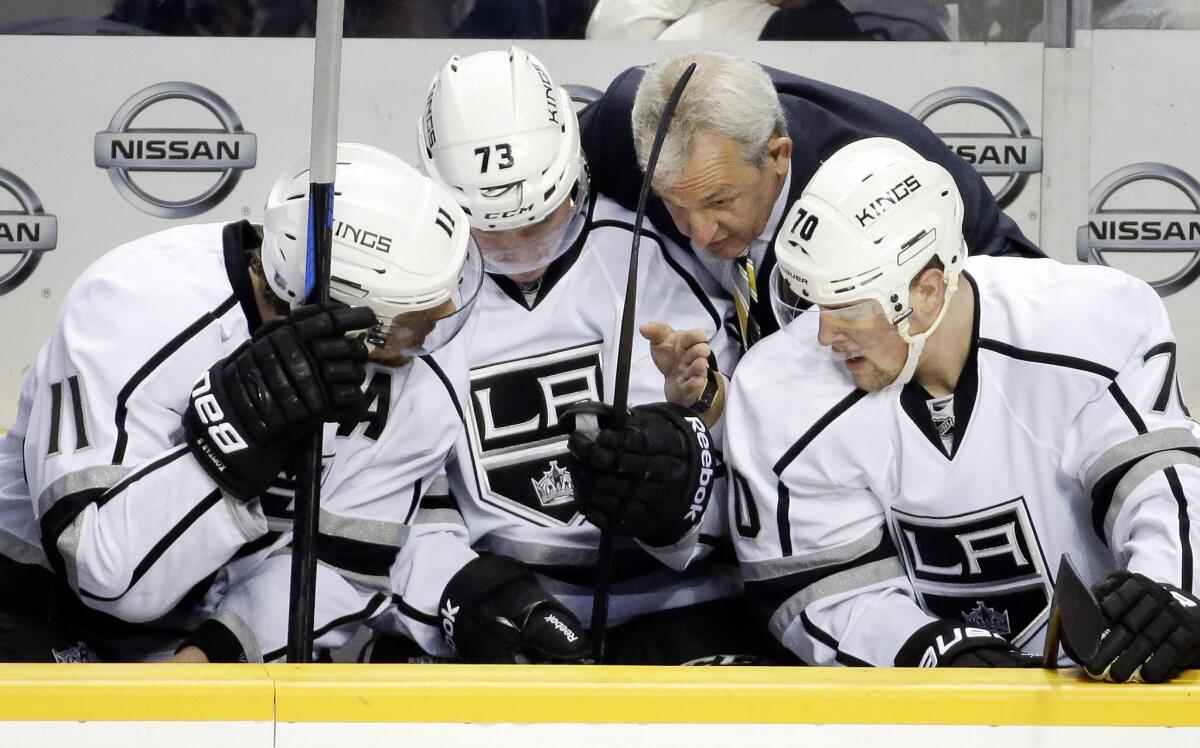 Kings Coach Darryl Sutter huddles with Anze Kopitar, Tyler Toffoli and Tanner Pearson during a game against the Predators on Nov. 25.