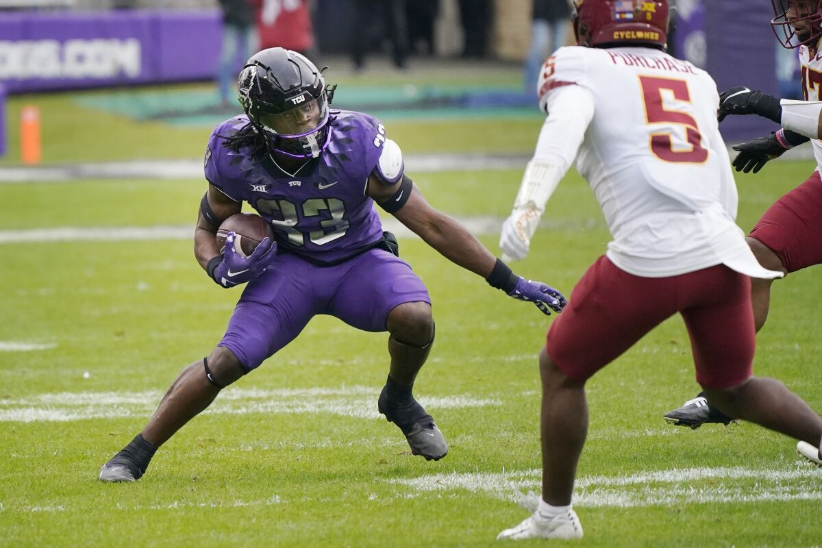 TCU running back Kendre Miller carries the ball against Iowa State on Nov. 26.