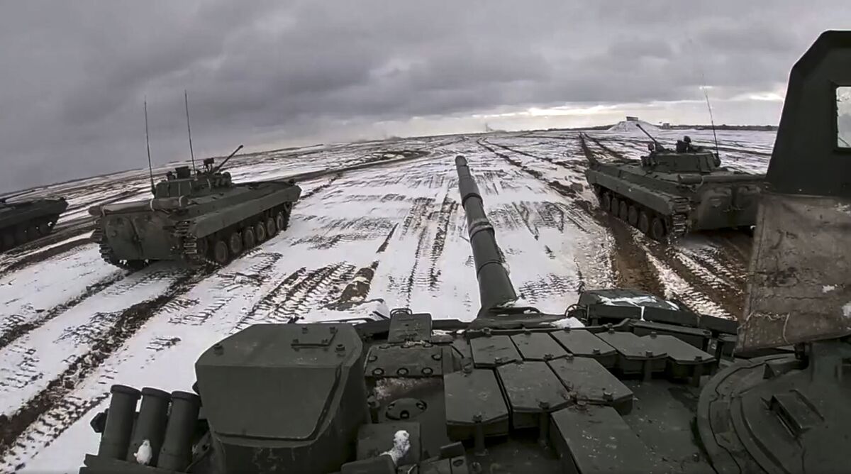 FILE - In this image from video released by the Russian Defense Ministry Press Service on Wednesday, Feb. 2, 2022, Russian and Belarusian tanks drive during a joint military drills at Brestsky firing range, Belarus. A buildup of an estimated 100,000 Russian troops near Ukraine has fueled Western fears of an invasion, but Moscow has denied having plans to launch an attack while demanding security guarantees from the the U.S. and its allies. (Russian Defense Ministry Press Service via AP, File)