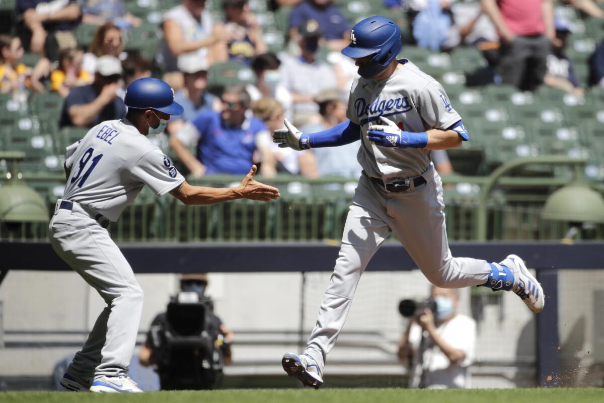 Los Angeles Dodgers Orel Hershiser, left, is congratulated by