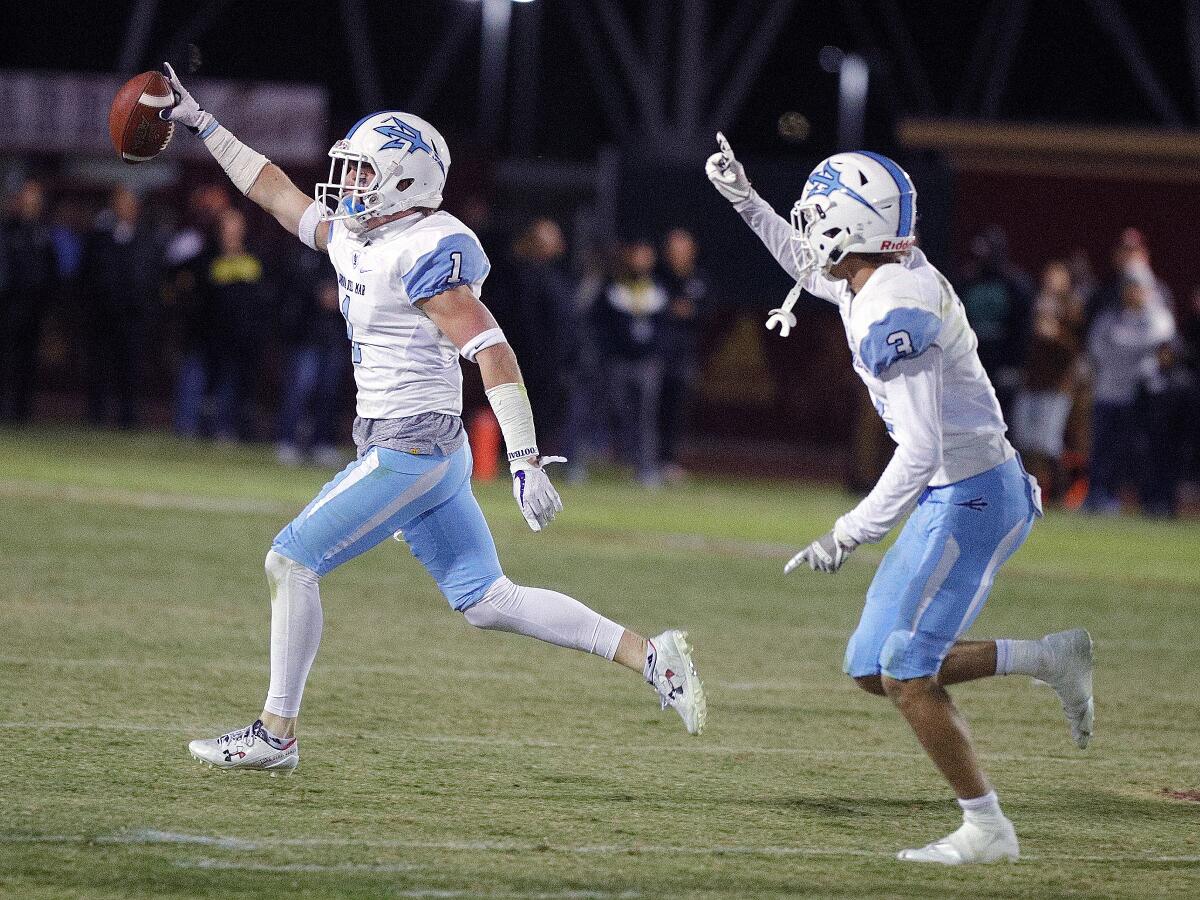 Corona del Mar's Chandler Fincher celebrates after intercepting an Alemany pass in a CIF Southern Section Division 3 semifinal playoff game in Mission Hills on Nov. 22.
