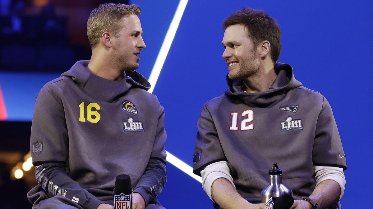 Rams quarterback Jared Goff, left, and New England's Tom Brady on Monday night in Atlanta.