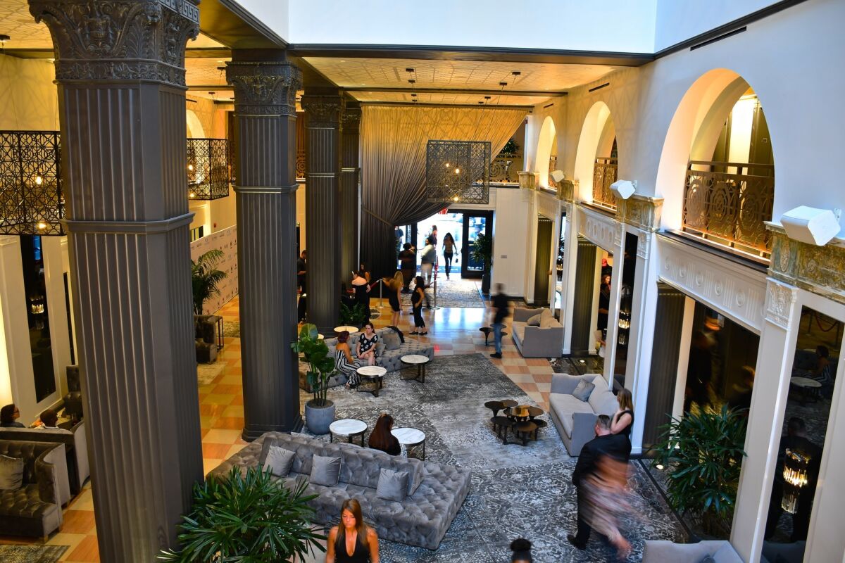 The lobby of the Mayfair Hotel, West 7th Street, Los Angeles, features a series of black columns.