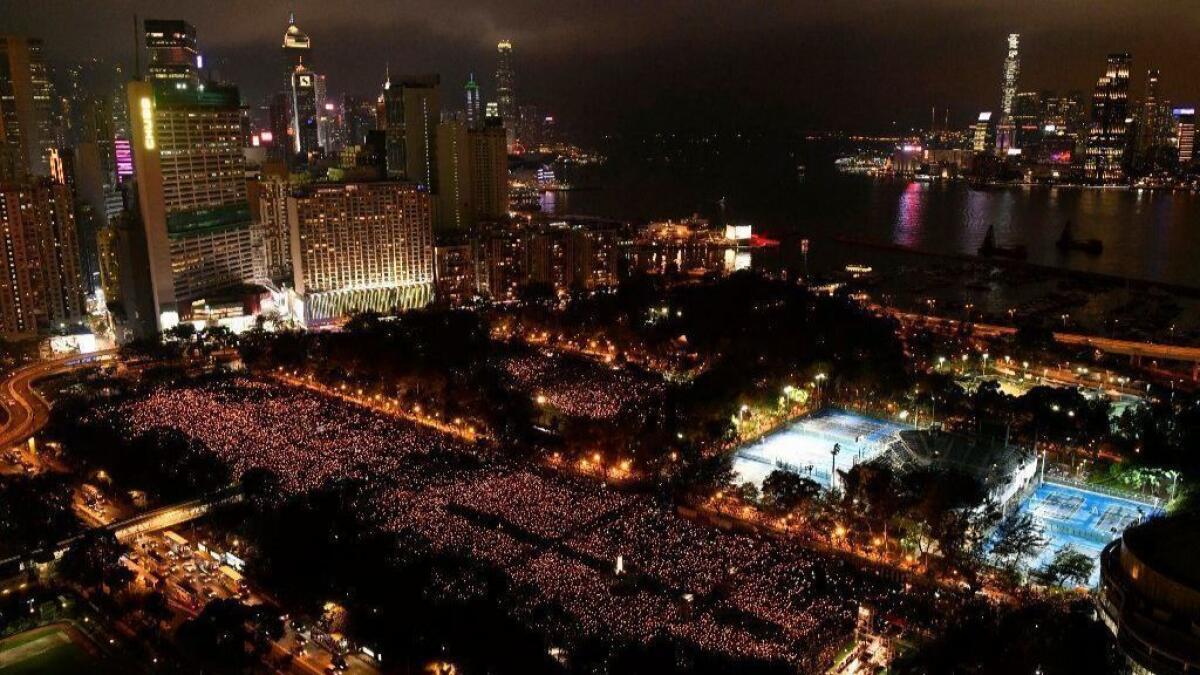 Thousands of people attend a candlelight vigil in Hong Kong for victims of the Chinese government's lethal 1989 crackdown on protesters in Beijing's Tiananmen Square.