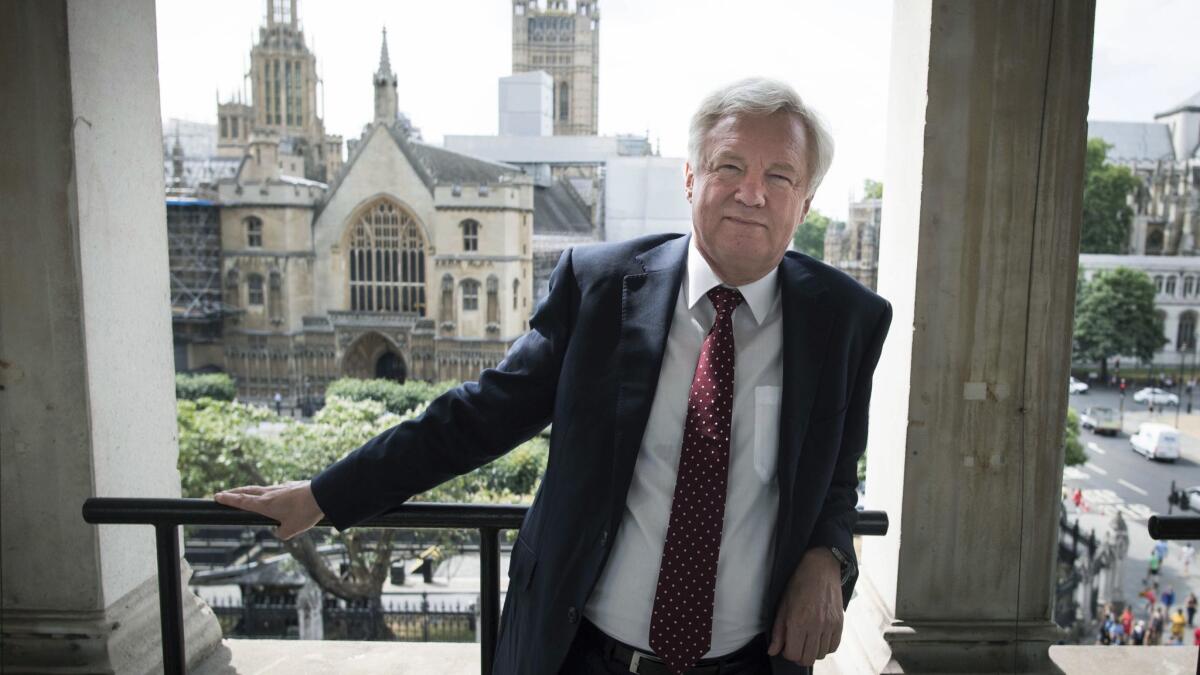 Britain's former chief Brexit official, David Davis, poses for a photo following his resignation on July 8.