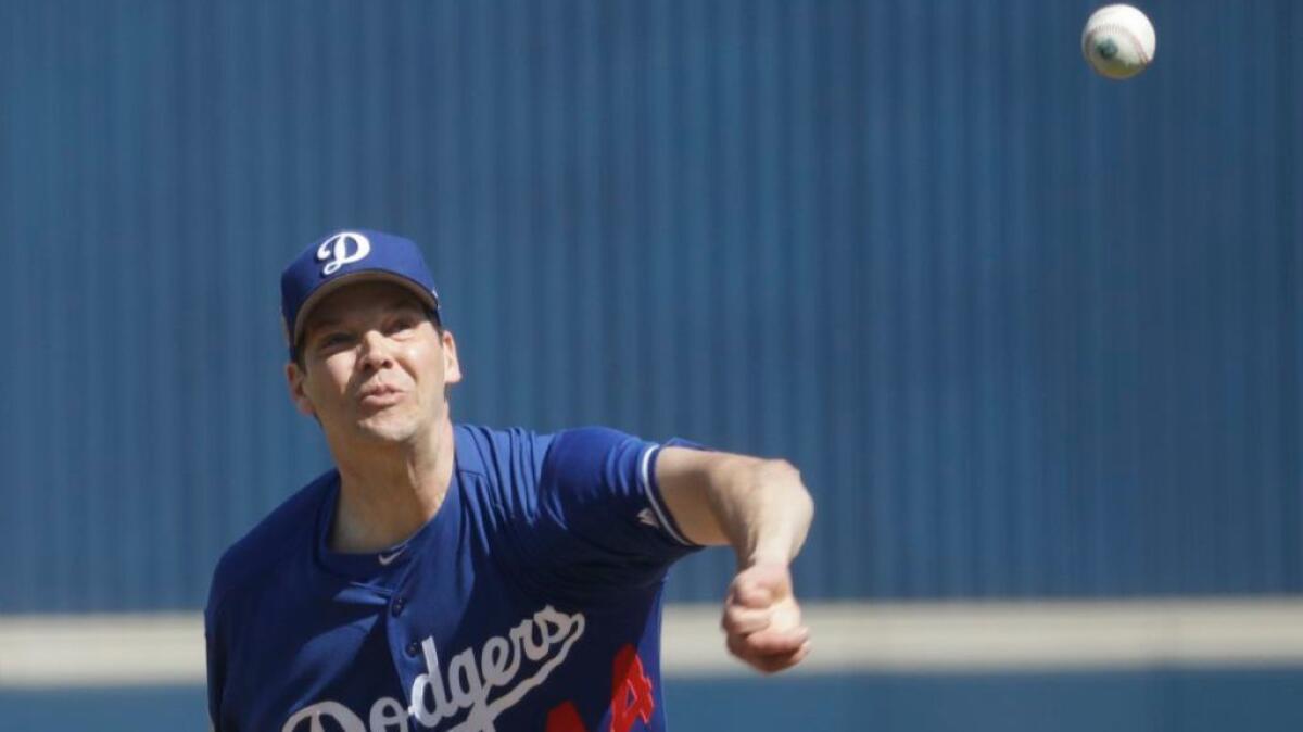 Dodgers left-hander Rich Hill throws during a spring training game against the Milwaukee Brewers on Feb. 26.