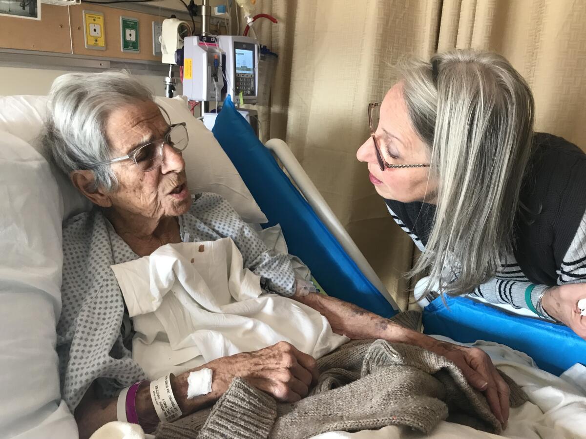 Grace Lopez, left, with her daughter Debbie Lopez, just before she was discharged from a hospital to hospice in January 2019.