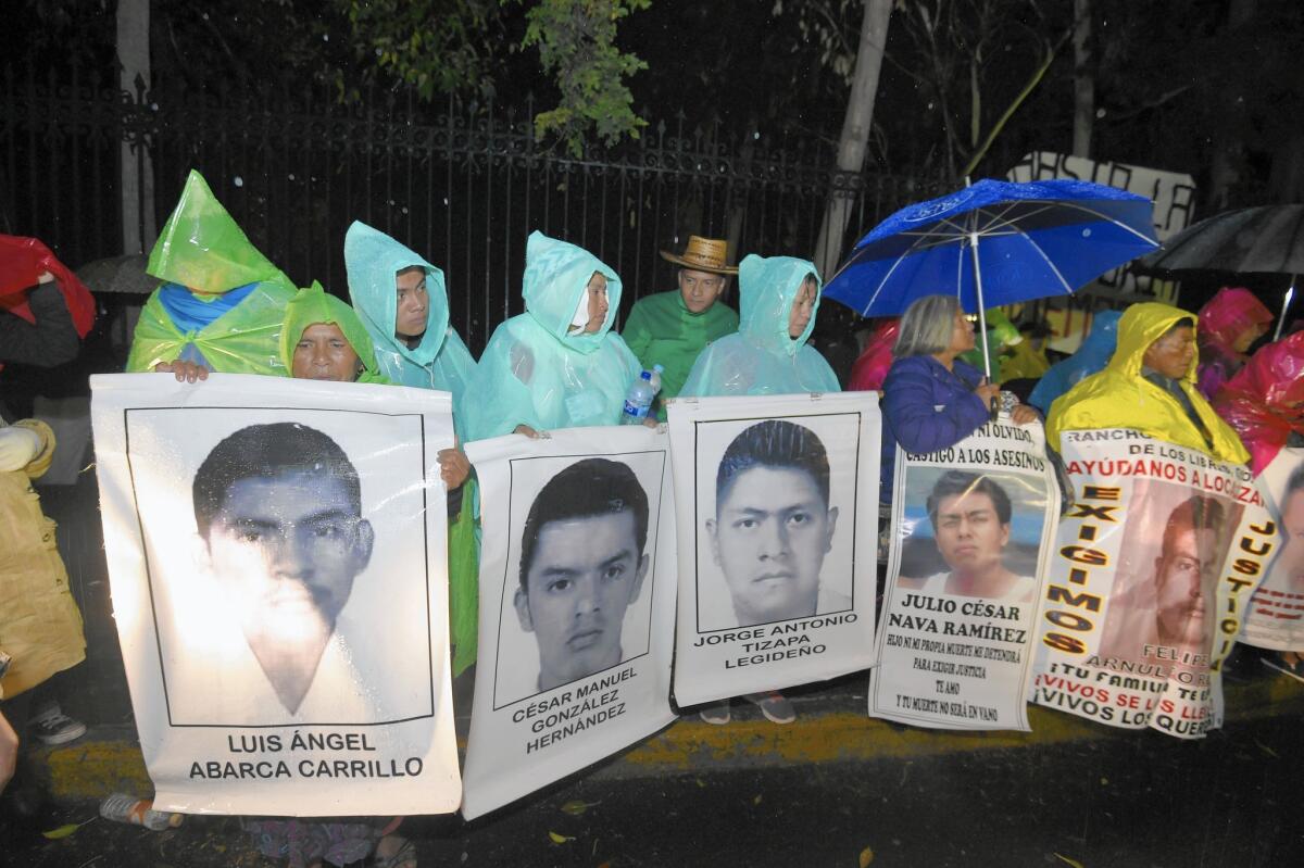 Relatives of the 43 Guerrero state students missing since September protest outside the presidential residence in Mexico City on Christmas Eve.