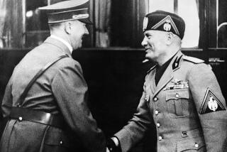 Italian dictator Benito Mussolini after watching the German Army manoeuvres at Mecklenburg, visited the famous Krupp armament factory in company with German Chancellor Adolf Hitler. Adolf Hitler, left, greeting Benito Mussolini on arrival at Essen, in Germany, on Sept. 27, 1937. (A Photo)