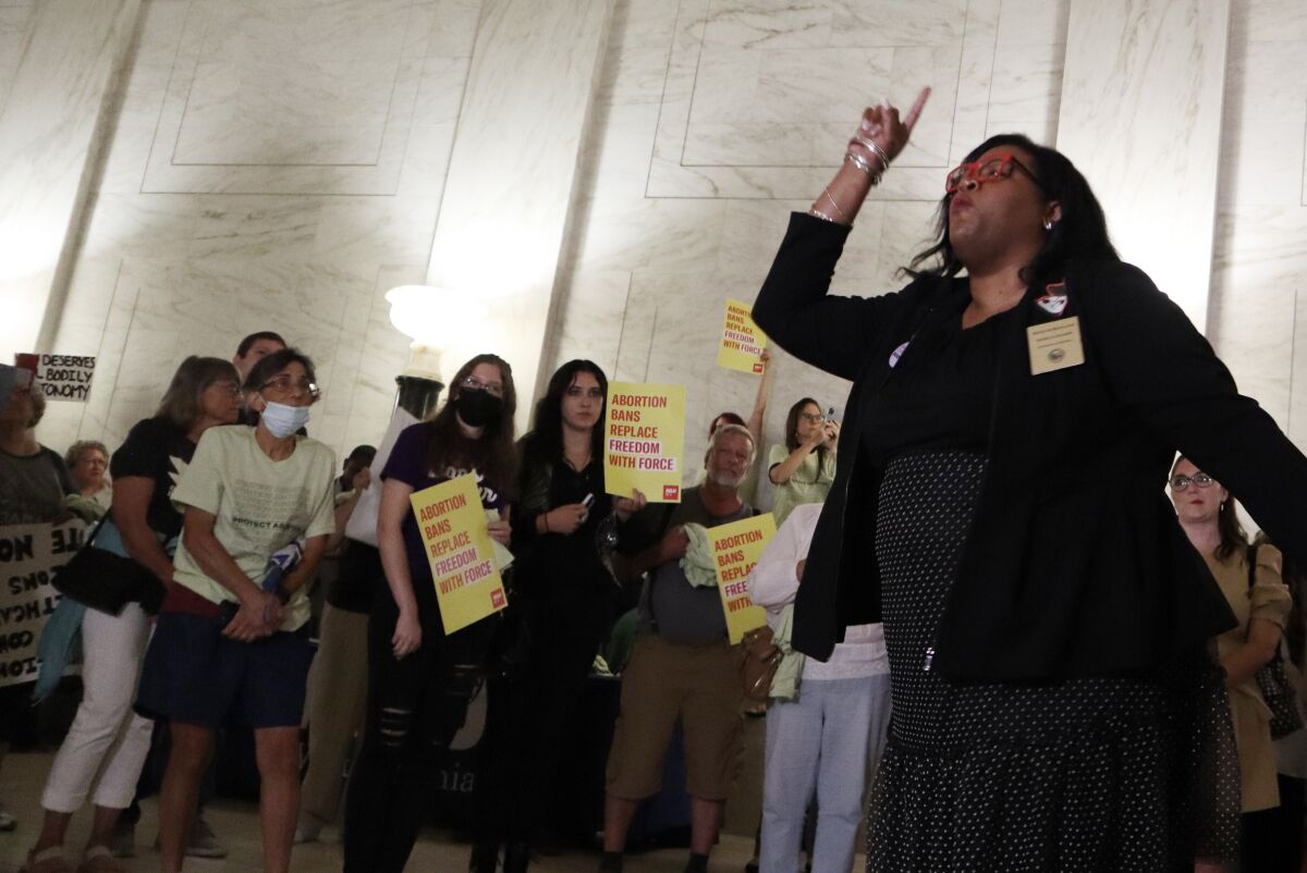 Democratic Del. Danielle Walker of Monongalia County speaks to a crowd protesting a sweeping abortion ban bill making its way through the West Virginia Legislature at the state Capitol on Wednesday, July 27, 2022 in Charleston, W.Va. (AP Photo/Leah Willingham)